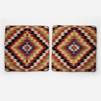 A pair of cushions 'Jynnen',  double-interlocked tapestry c 52 x 30 cm each, southwestern Scania, circa 1800.