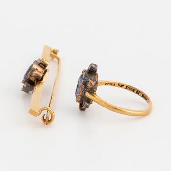 An 18K gold brooch and ring set with oval, mixed-cut sapphires and rose-cut diamonds.