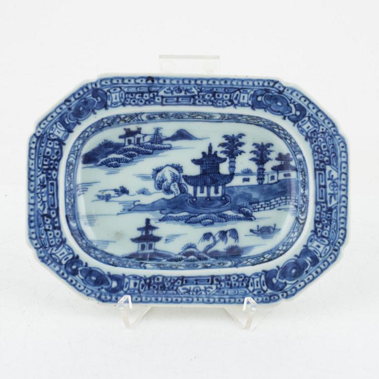 Two blue and white porcelain serving dishes and a stand for a butter tureen, China, Qianlong (1736-95).