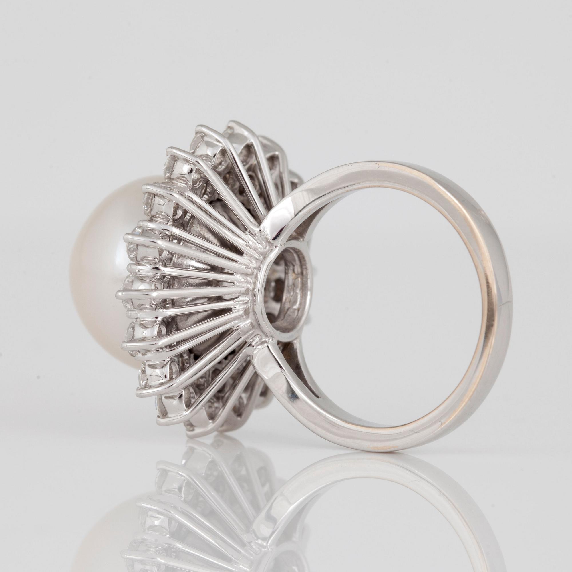 A cultured South Sea pearl and diamond ring.