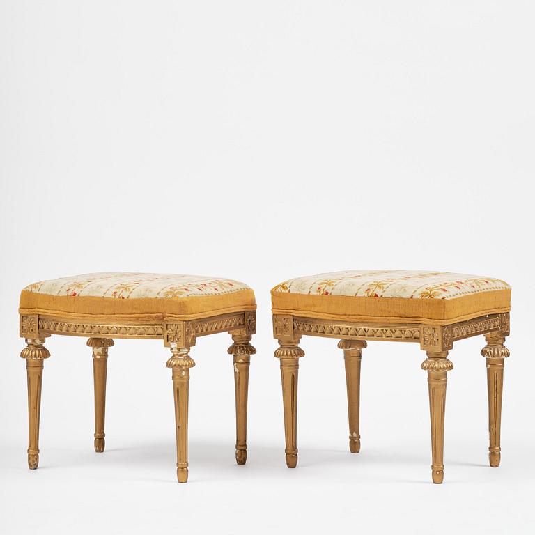 A pair of giltwood stools by E. Ståhl (master in Stockholm 1794-1820).