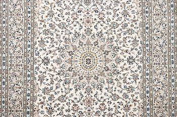 A Kashan carpet, c. 345 x 240 cm.