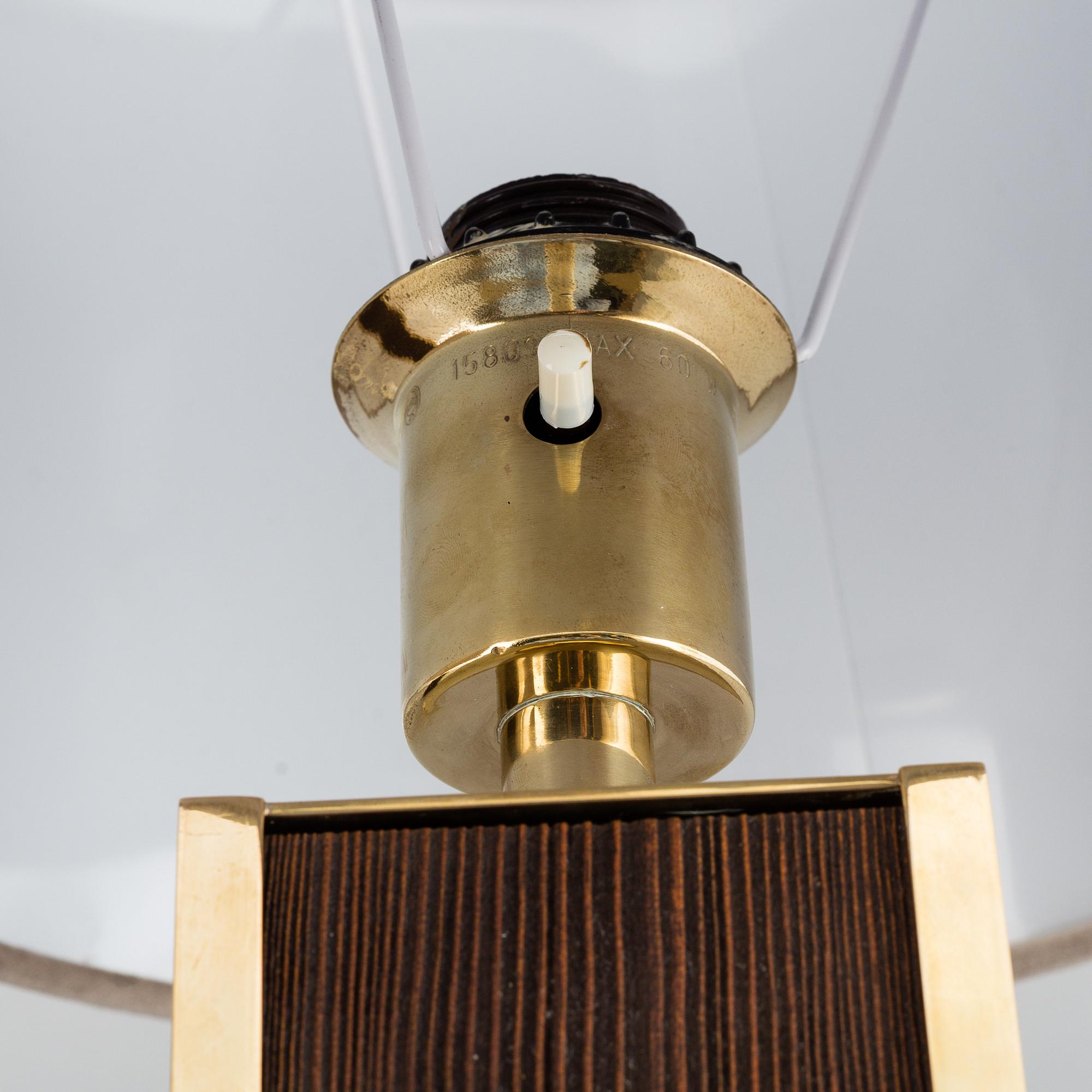 A second half of the 20th Century pair of pine and brass table lights.