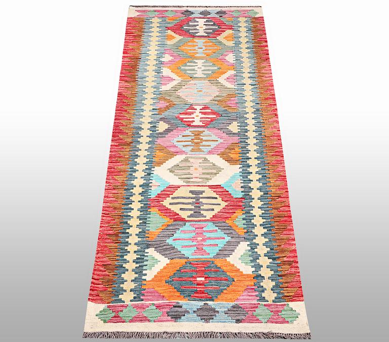 A Kilim runner, a. 294 x 82 cm.