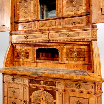 A German walnut and mahogany writing cabinet around 1800.