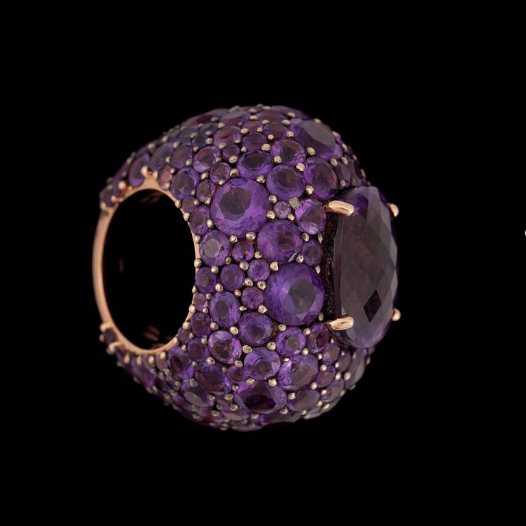 A large amethyst ring.