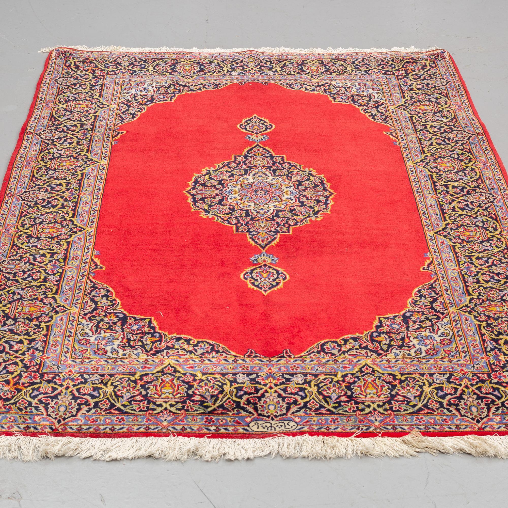 A RUG, a Kashan, ca 227 x 142 cm, signed Kashan - Shadi/Keshan Shadsar.