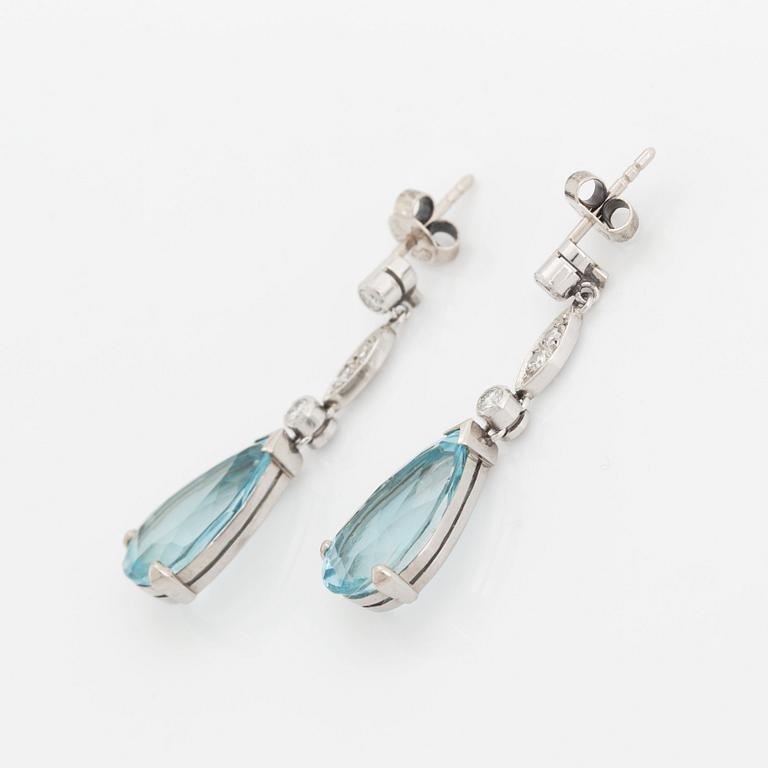 A pair of 18K white gold and aquamarine drop earrings set with round brilliant- and eight-cut diamonds.