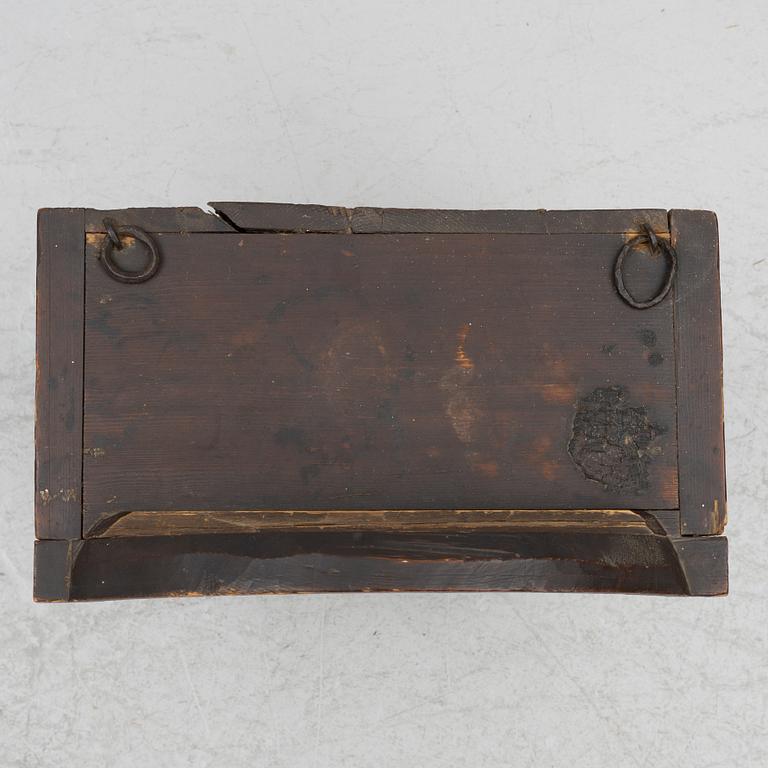 A hanging cabinet, dated 1870.