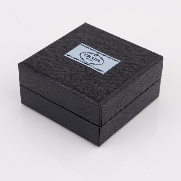 Prada, a pair of clip-on rhinestone and strass earrings.