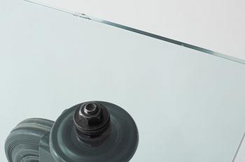 A Gae Aulenti 'Tavola con Ruote' table, Fontana Arte, Italy.