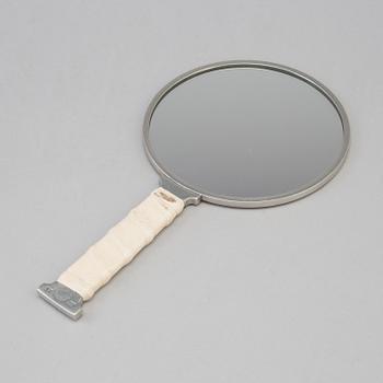 A mirror by Eric Ericson for Firma Svenskt Tenn, 2012.