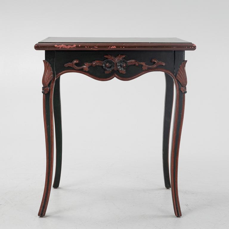 A painted table with a drawer, 20th Century.