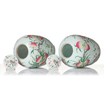 A pair of famille rose 'peaches' jars with cover, Qing dynasty, circa 1900.
