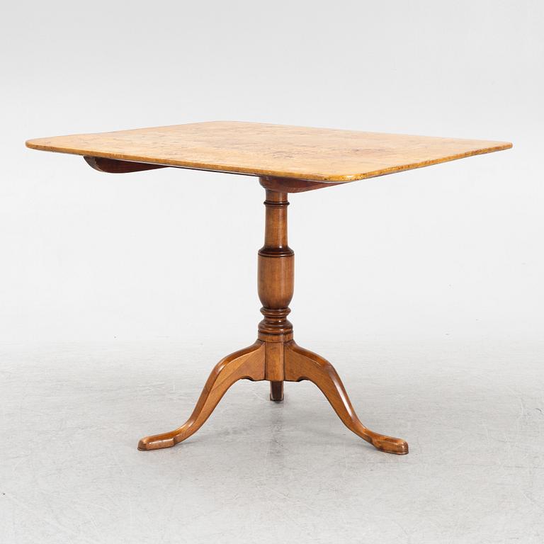 A tilt-top table, around 1800.