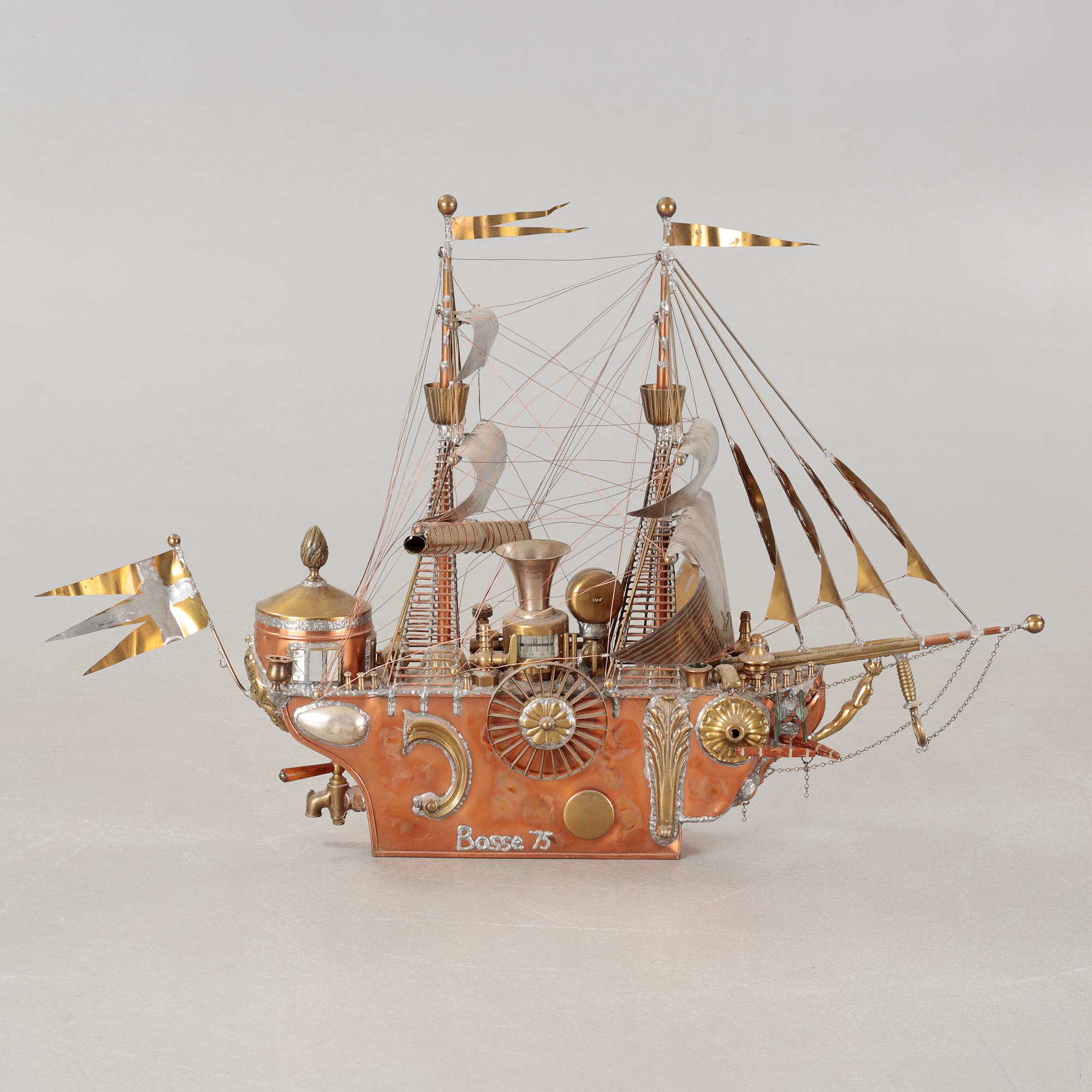 A boat sculpture, dated -75.