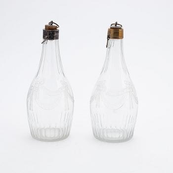 A pair of late gustavian glass and silver vinegar bottles, circa 1800.