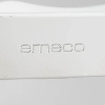 A pair of plastic 'Navy Chair' by Emeco.