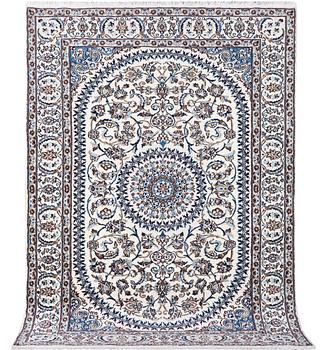 A Nain carpet, part silk, c. 291 x 201 cm.