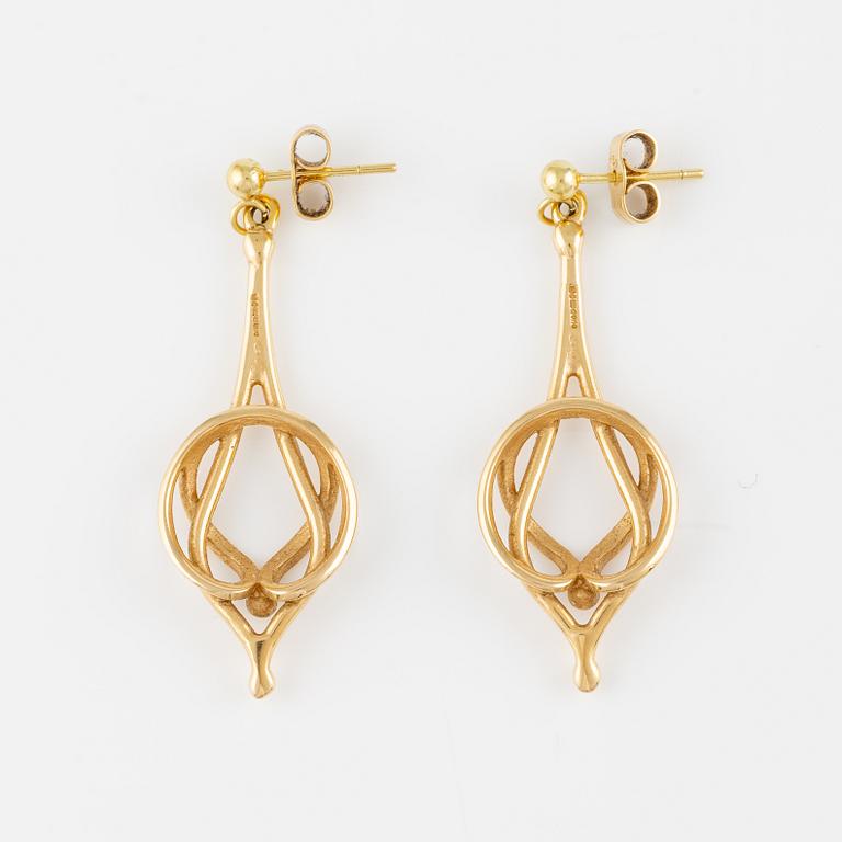 A pair of 18K gold earrings.