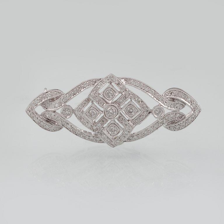 BROSCH, 18K vitguld med briljantslipade diamanter. Vikt 7,2 gram.