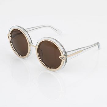 Karen Walker, a pair of "Orbit" sunglasses.