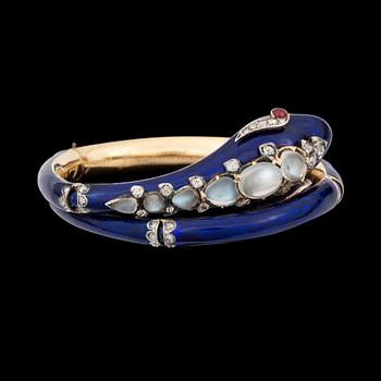 993. A blue enamel, moonstone, ruby and diamond bracelet in the shape of a serpent. England circa 1845.