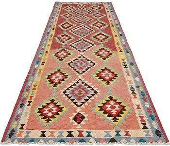 A kurdish kilim carpet, Western Iran, c 323 x 113 cm.