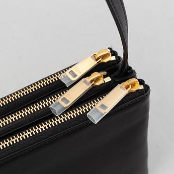 Céline, a black leather 'Trio Bag'.