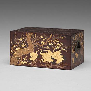 560. A Japanese lacquered box, 19th Century.