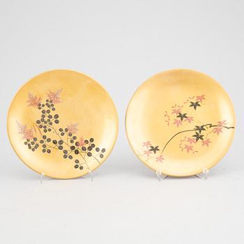 A set of six lacquered and painted Japanese plates, 20th Century.