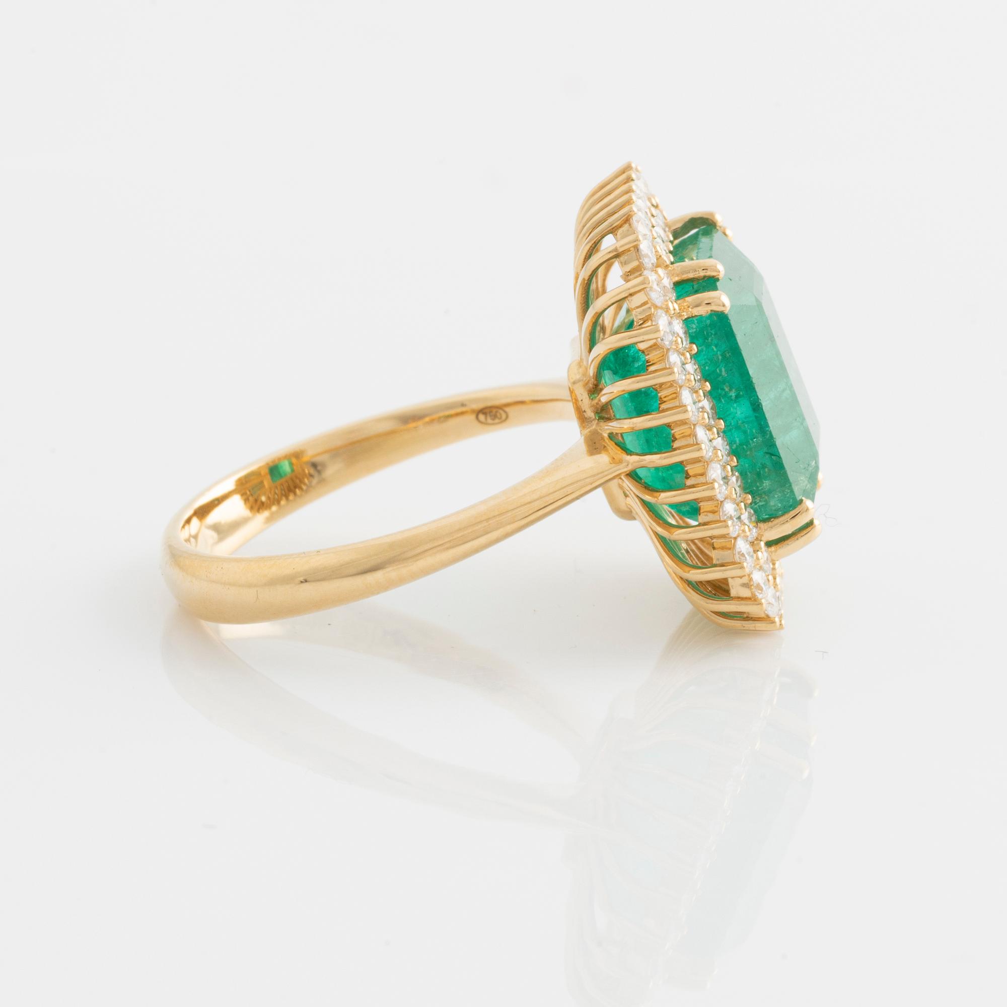 Ring with emerald-cut emerald and brilliant-cut diamonds.