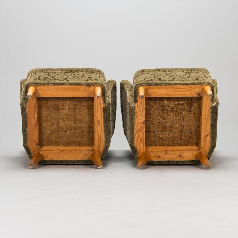 A pair of 1950s armchairs.
