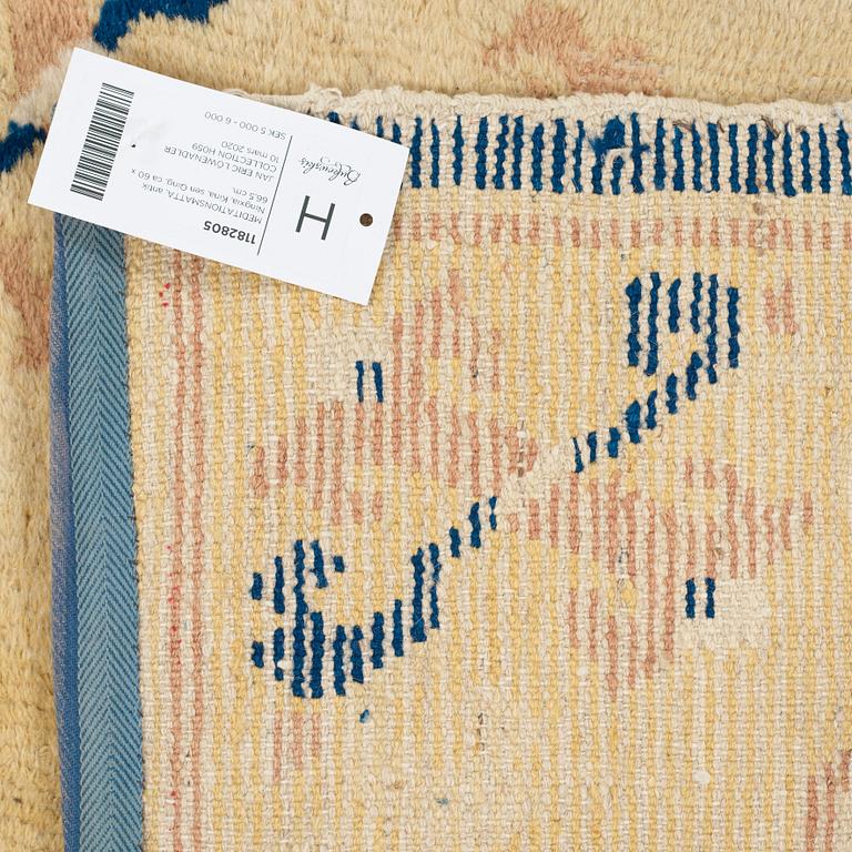 A MEDITATION RUG, an antique Ningxia, China, late Qing, ca 60 x 66,5 cm.