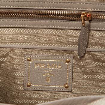 A leather handbag by Prada.