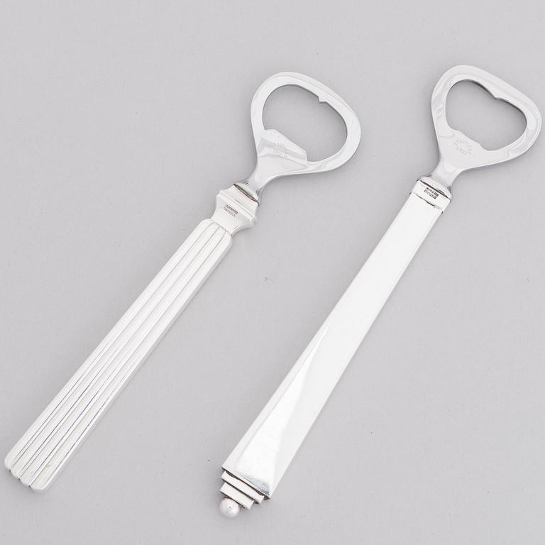 HARALD NIELSEN and SIGVARD BERNADOTTE, Two sterling silver and stainless steel bottle openers, Georg Jensen, Denmark.