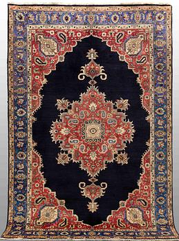 A carpet Tabriz around 265 x 170 cm.