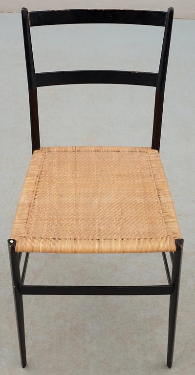 A Gio Ponti 'Superleggera' chair, Cassina, Italy, black painted ash with ratten seat.