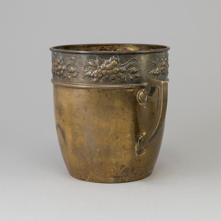 A brass jugend-style champagne cooler from early 21 st century.