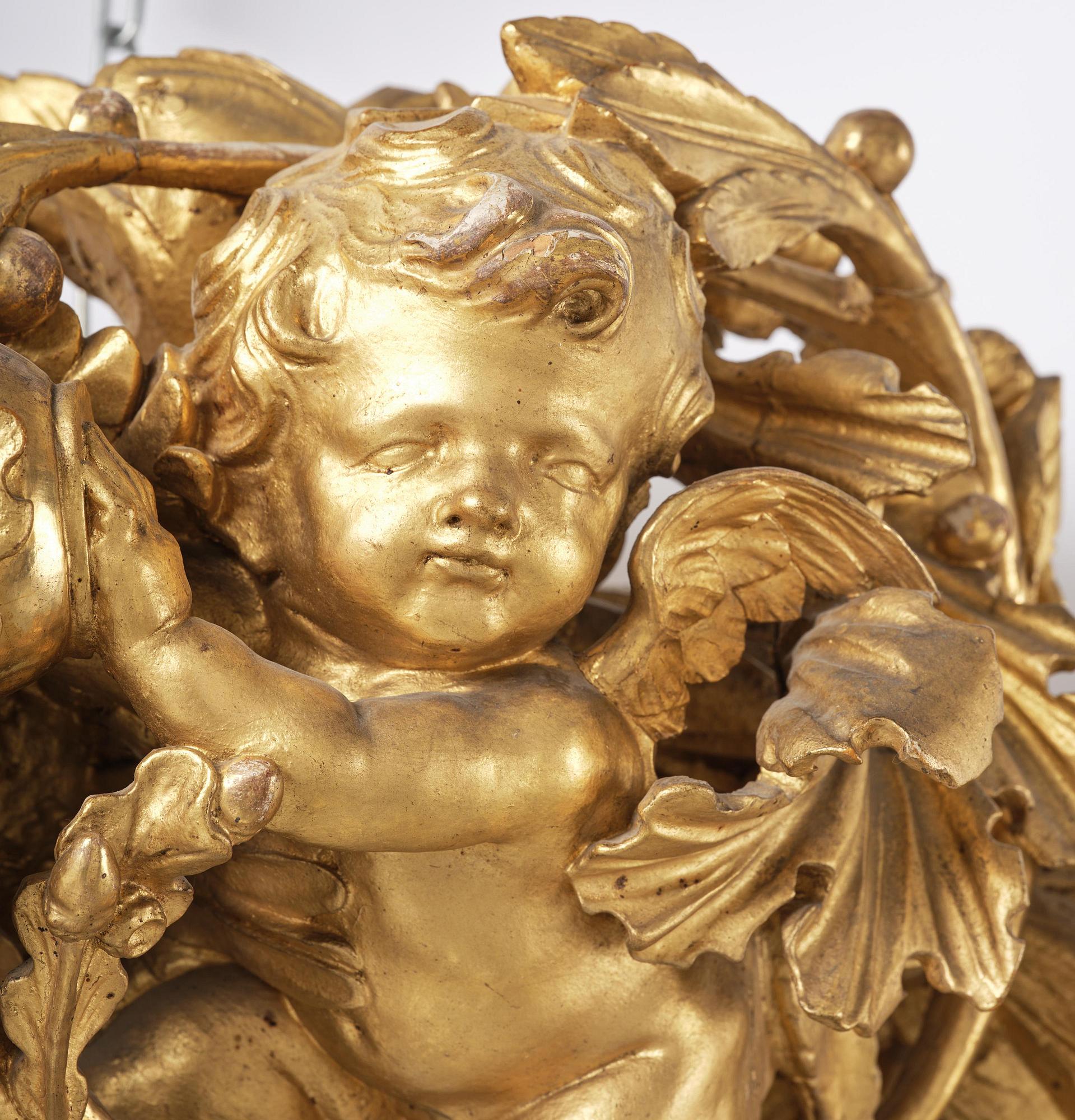 A presumably Dutch Louis XIV carved giltwood frame with mirror glass, in the style of Jean Le Pautre, late 17th century.