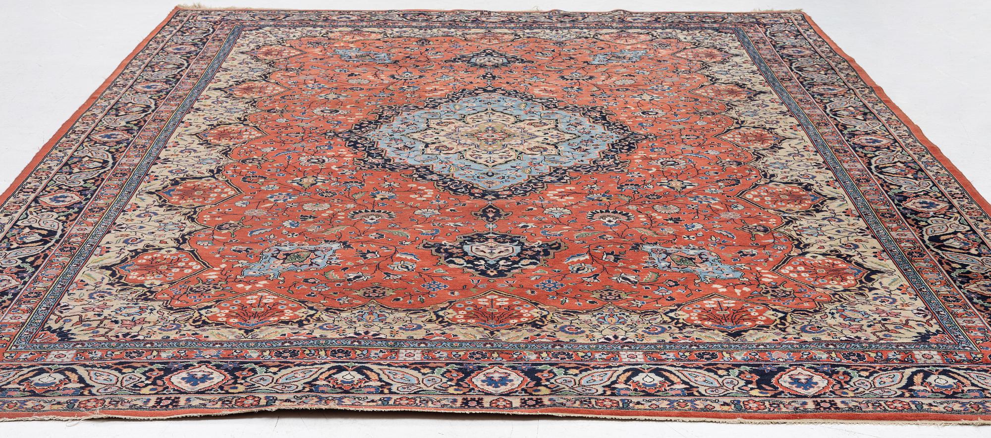 An oriental carpet, c. 370 x 275 cm.