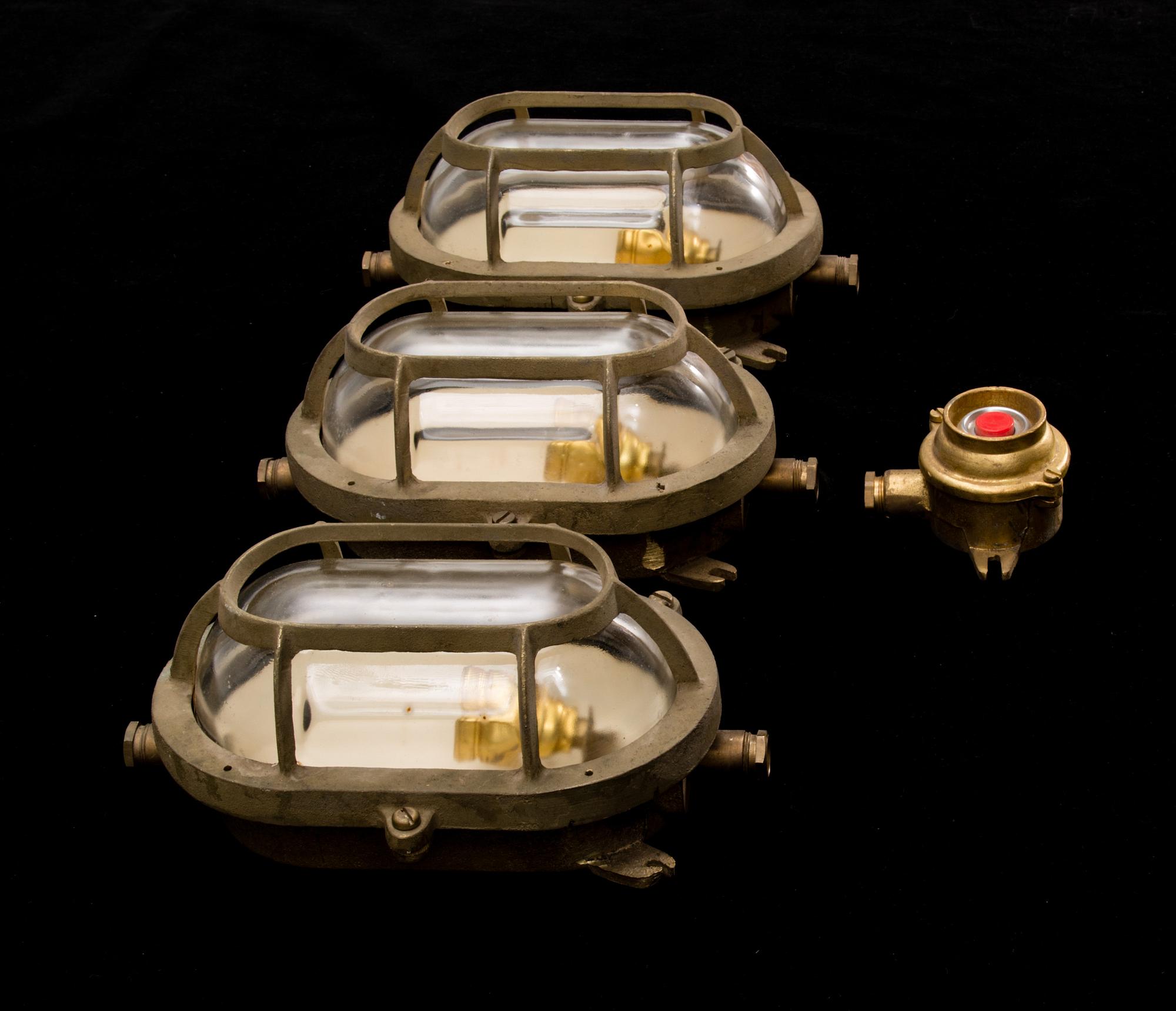 A set of three lights and a switcher from the latter half of the 20th century.