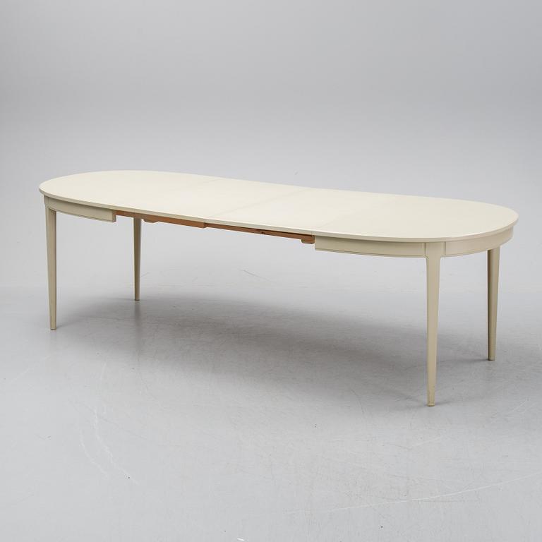 A dining table with six chairs by Carl Malmsten, second half of the 20th Century.