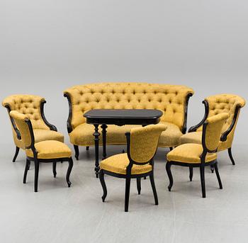 A set of three chairs, two easy chairs, one sofa and one table, end of the 19th century.