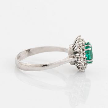 Emerald and brilliant cut diamond  cluster ring.
