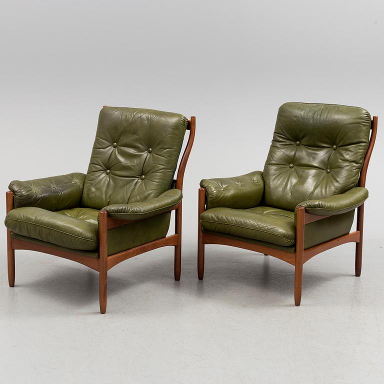 A pair of stained beech and leather easy chairs from Göte Möbler, Nässjö, second half of the 20th century.