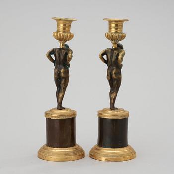A pair of Empire early 19th century candlesticks.
