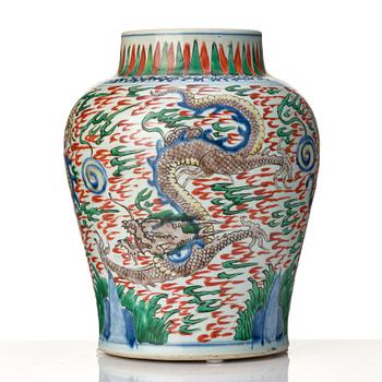 A matched pair of Transitional Wucai jars, 17th Century.