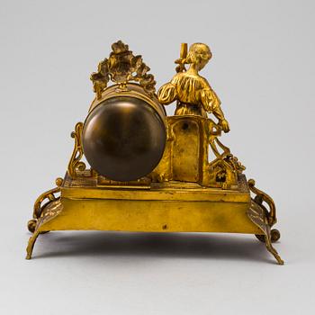 A LATE 19TH CENTURY GILT METAL MANTLE CLOCK in the Rococo style.
