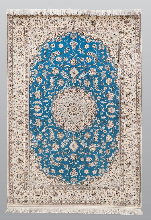 A rug, Nain part silk s.k 6LAA, ca 237 x 157 cm.